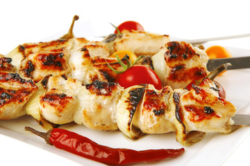 roast chicken shish kebab on white