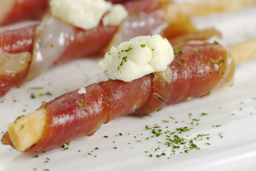 Bacon slice on salt stick with cheese (Selective Focus)