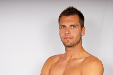 Fototapeta premium Attractive young man shows business card