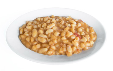Beans soup on white dish.