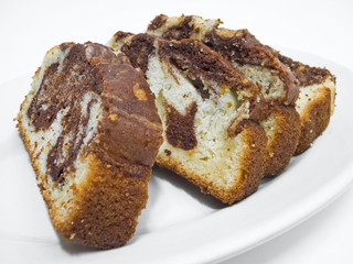 Chocolate plumcake on white dish.