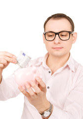 businessman with piggy bank and money