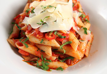 Photograph of penne pasta with parmesan cheese