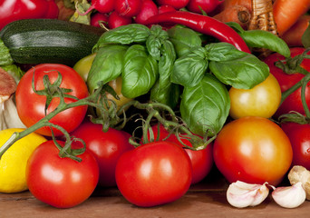 Full Frame of Garden Tomato and Basil on Wood Table