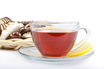 Cup of tea  with lemon and pastries