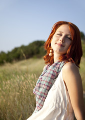 Fototapeta premium Girl at hill in sunrise.
