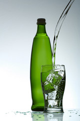 Cold purified water in the glass with bubbles