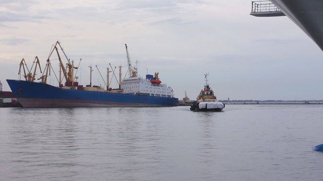 Tug-boat at the sea trading port (Full HD)