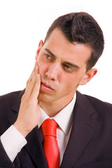 Young business man whith a toothache over white background
