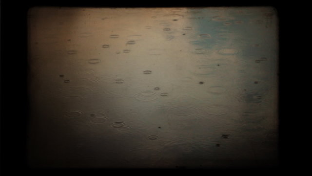 Drops in a pond. Vintage styled and colored background.