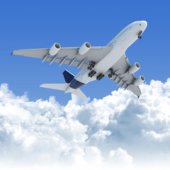 Fototapeta na wymiar Samolot lecący nad chmurami po starcie