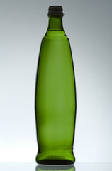 Purified mineral water on the wet glass desk with reflection