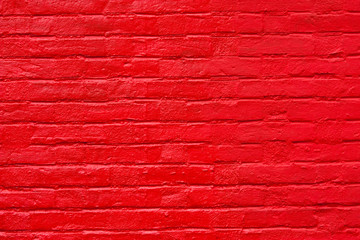 Bright red painted brick wall