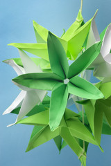 Closeup of big green origami star flowers from paper