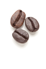 Three Roasted Coffee Beans on White