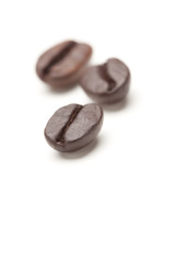 Three Roasted Coffee Beans on White
