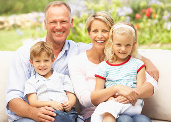 Family Relaxing In Garden