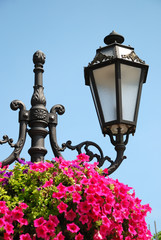 Fototapeta na wymiar Decorative street lantern with flowers