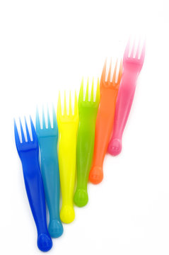 Plastic knife ,fork, spoon on white background