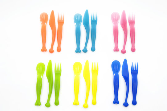 Row of plastic knife ,fork, spoon