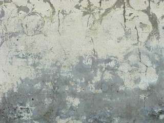 worn gray pastel yellow painted wall with crack and blathering