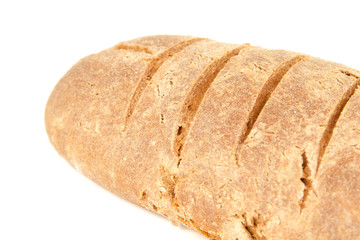 long loaf of hot whole rye kosher bread isolated on white