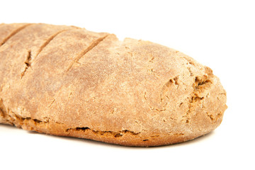 long loaf of hot whole rye kosher bread isolated on white