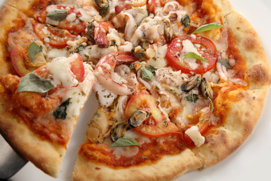 Pizza seafood portion close up