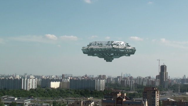 UFO flying over the town