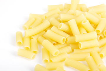 Close up of raw italian pasta on white