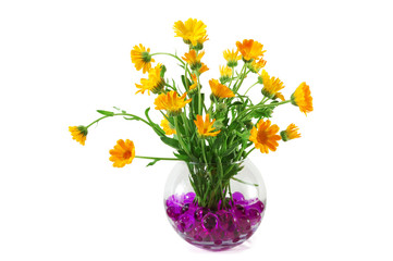 Marigold flowers in a vase with colorful crystal beads