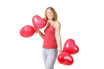 Junge Frau mit Luftbaloonherzen