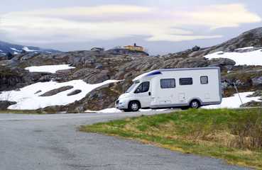 Caravan van on high-mountainous road of Norway