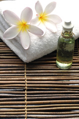 White frangipani on towel in the spa