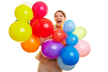 Fototapeta na wymiar Geschäftsfrau feiert mit bunten Ballons