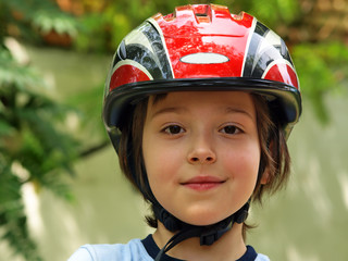 Fototapeta na wymiar Boy with a bike helmet