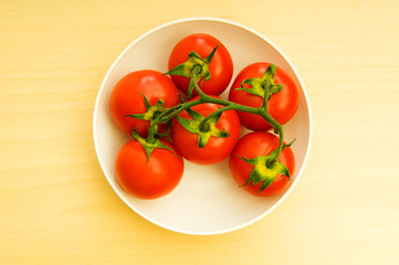 Red tomatoes isolated on the white background