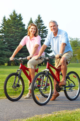 seniors couple biking