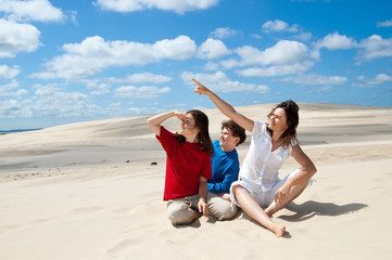 Fototapeta premium Mother with kids sitting and looking