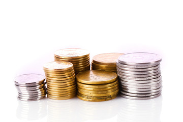 Many coins in column isolated on white