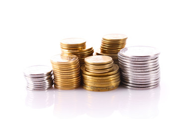 Many coins in column isolated on white