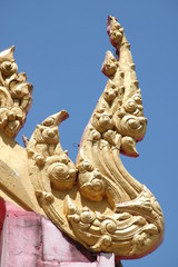 Fototapeta na wymiar naga fin on roof of temple, Wat ban kor, Mahasarakam