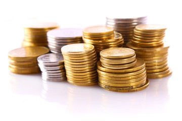 Many coins in column isolated on white
