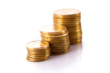 Many coins in column isolated on white
