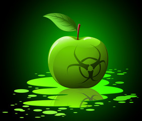Green toxic apple with biohazard sing on black background
