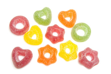 Colored candy with sugar over white background