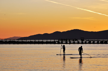 Fototapeta premium Standing up paddling in English Bay
