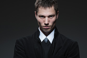 serious man over dark background