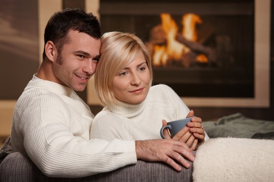 Couple hugging home