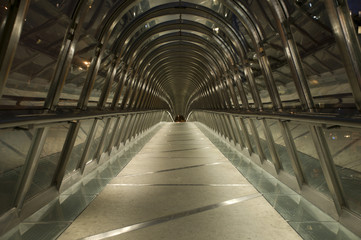 Bridge covered by roof made of chrome and glass